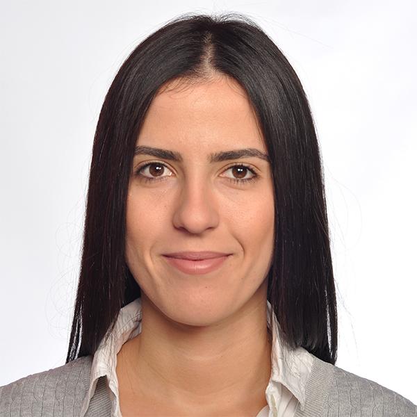 Jovana seated in a monochrome studio portrait